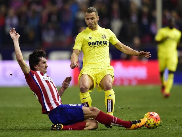Stefan Savic and Roberto Soldado in action during the La Liga game between Atletico Madrid and Villarreal on February 20, 2016