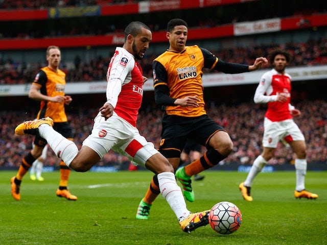 Theo Walcott and Curtis Davies in action during the FA Cup game between Arsenal and Hull City on February 20, 2016