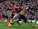 Little Adnan Januzaj is bullied by Gabriel during the Premier League game between Manchester United and Arsenal on February 28, 2016
