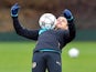 Alexis Sanchez feels the cold during a training session ahead of the Champions League clash between Arsenal and Barcelona on February 22, 2016