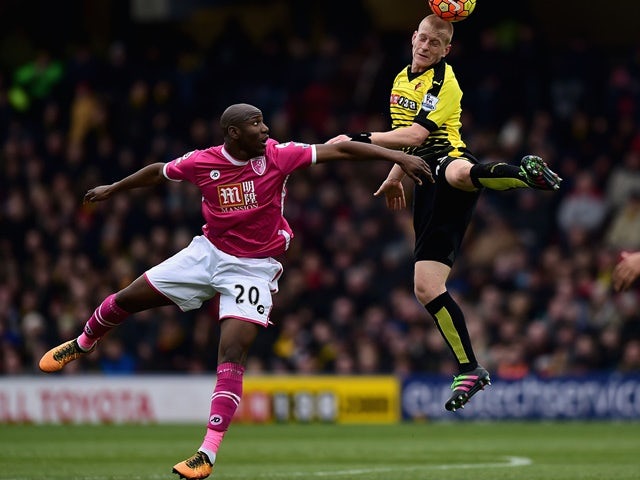 Ben Watson of Watford and Benik Afobe of Bournemouth compete for the ball on February 27, 2016