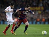 Benoit Tremoulinas and Lionel Messi in action during the La Liga game between Barcelona and Sevilla on February 28, 2016