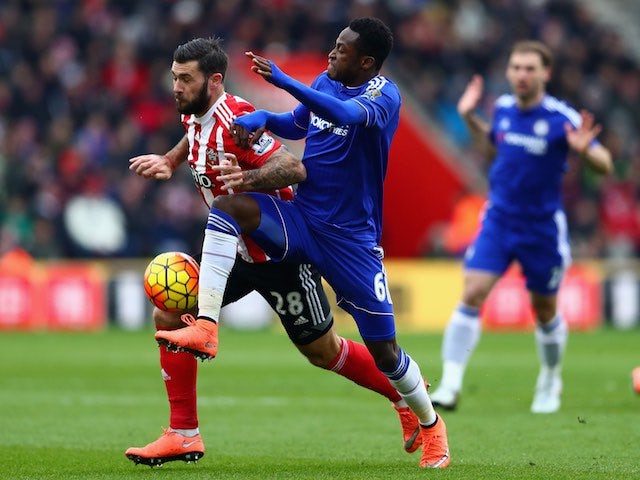 Charlie Austin and Baba Rahman in action during the Premier League game between Southampton and Chelsea on February 27, 2016