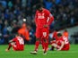 Daniel Sturridge and Liverpool teammates react after Manchester City win the League Cup on February 28, 2016