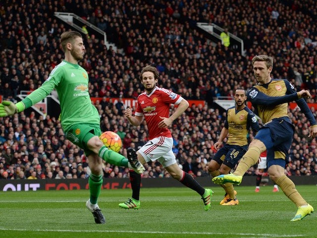 David de Gea blocks an effort from Nacho Monreal during the Premier League game between Manchester United and Arsenal on February 28, 2016
