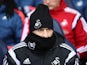 Francesco Guidolin attempts to go unnoticed during the Premier League game between Tottenham Hotspur and Swansea City on February 28, 2016