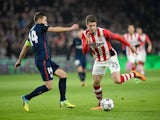 Atletico Madrid's Gabi and Marco van Ginkel of PSV Eindhoven battle for possession during the Champions League last-16 first leg on February 24, 2016