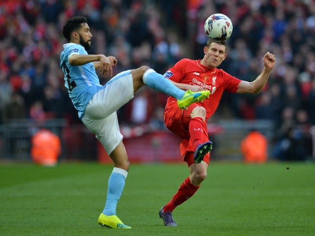 Gael Clichy and James Milner in action during the League Cup final between Liverpool and Manchester City on February 28, 2016