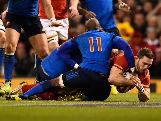 George North of Wales crashes over the line to score the opening try during the Nations match against  France at the Principality Stadium on February 26, 2016