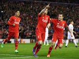 James Milner celebrates with Philippe Coutinho and Roberto Firmino during the Europa League game between Liverpool and Augsburg on February 25, 2016