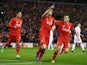 James Milner celebrates with Philippe Coutinho and Roberto Firmino during the Europa League game between Liverpool and Augsburg on February 25, 2016