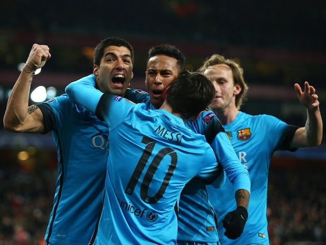 Lionel Messi, Neymar and Luis Suarez celebrate a rare goal during the Champions League game between Arsenal and Barcelona on February 22, 2016