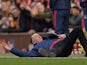 Louis van Gaal dives to the ground during the Premier League game between Manchester United and Arsenal on February 28, 2016