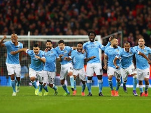 Manchester City players celebrate winning the League Cup on February 28, 2016