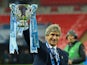 Manuel Pellegrini celebrates with the League Cup trophy on February 28, 2016
