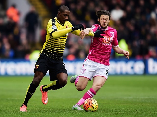 Odion Ighalo of Watford and Harry Arter of Bournemouth compete for the ball on February 27, 2016