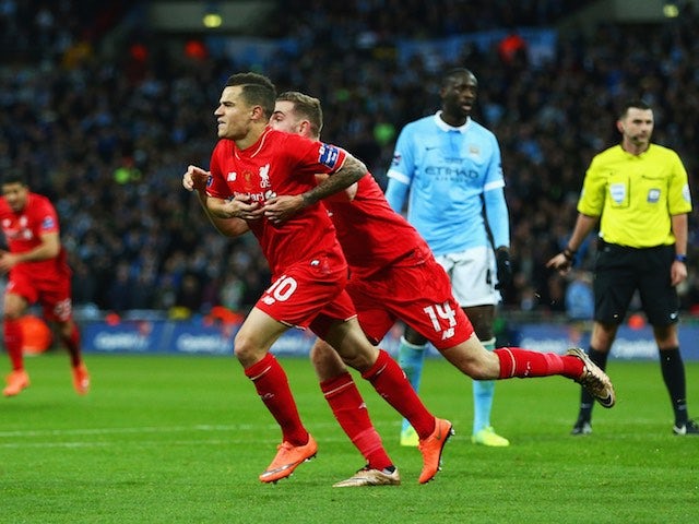 Philippe Coutinho and Jordan Henderson celebrate during the League Cup final between Liverpool and Manchester City on February 28, 2016