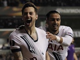 Ryan Mason yanks away at his shirt after scoring during the Europa League game between Tottenham Hotspur and Fiorentina on February 25, 2016