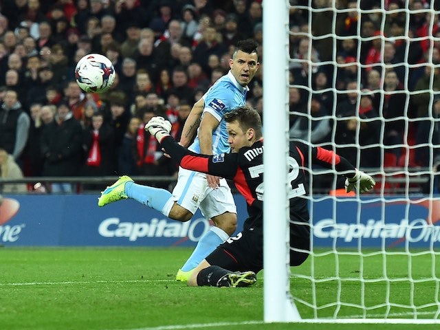 Simon Mignolet saves a Sergio Aguero shot during the League Cup final between Liverpool and Manchester City on February 28, 2016