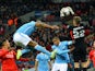 Simon Mignolet claims the ball as Vincent Kompany attacks during the League Cup final between Liverpool and Manchester City on February 28, 2016