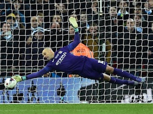 Willy Caballero saves Adam Lallana's penalty during the League Cup final between Liverpool and Manchester City on February 28, 2016