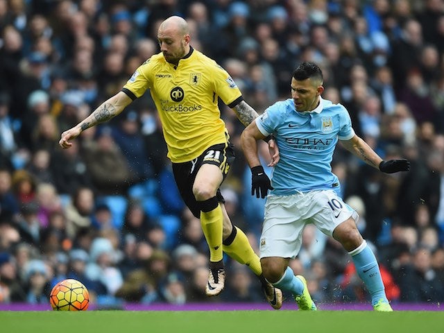 Alan Hutton and Sergio Aguero in action during the Premier League game between Manchester City and Aston Villa on March 5, 2016