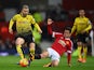 Ander Herrera slides in to tackle Valon Berami during the Premier League match between Manchester United and Watford at on March 2, 2016