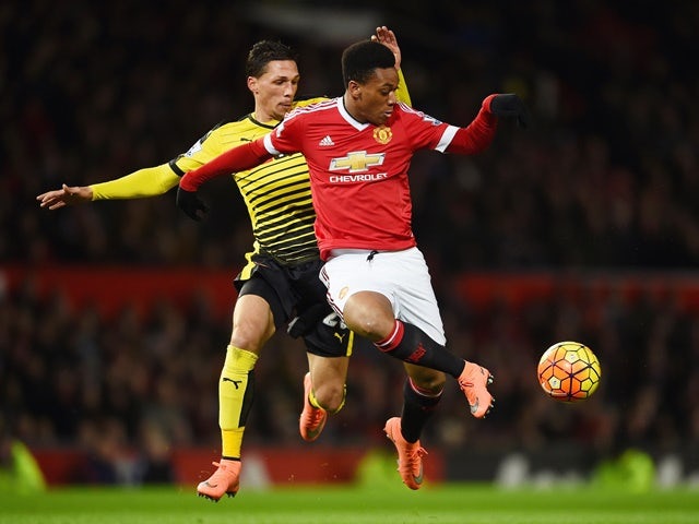 Anthony Martial of Manchester United battles for the ball with Jose Holebas of Watford on March 2, 2016