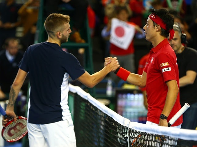 Dan Evans of Great Britain and Kei Nishikori of Japan shake hands following their singles match on day one of the Davis Cup World Group on March 4, 2016