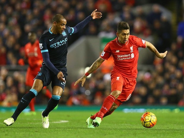Fernando and Roberto Firmino in action during the Premier League game between Liverpool and Manchester City on March 2, 2016