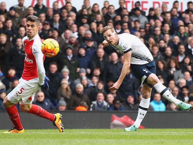 Harry Kane takes a shot past Gabriel during the Premier League game between Tottenham Hotspur and Arsenal on March 5, 2016
