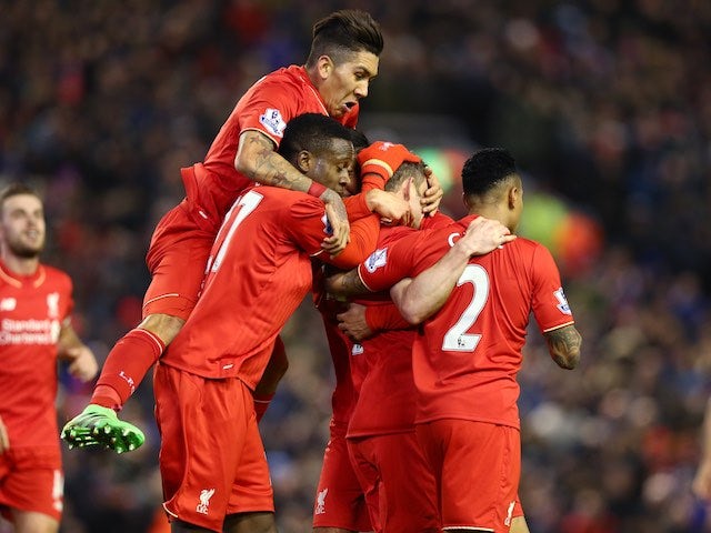 James Milner is mounted by teammates after scoring during the Premier League game between Liverpool and Manchester City on March 2, 2016