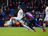 Jordan Henderson evades Wilfried Zaha during the Premier League game between Crystal Palace and Liverpool on March 6, 2016