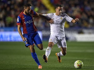Jose Luis Morales competes for the ball with Lucas VAZQUEZ during the La Liga match between Levante and Real Madrid on March 02, 2016