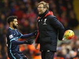 Jurgen Klopp hides the ball from Gael Clichy during the Premier League game between Liverpool and Manchester City on March 2, 2016