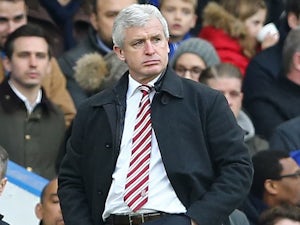Mark Hughes watches on during the Premier League game between Chelsea and Stoke City on March 5, 2016