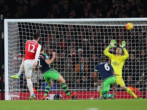 Olivier Giroud of Arsenal sees his shot saved by Lukasz Fabianski of Swansea City on March 2, 2016
