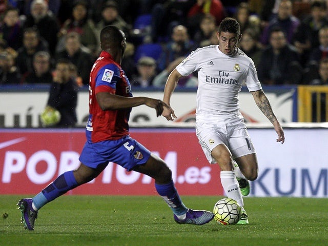 Levante's Simao vies with Real Madrid's James Rodriguez on March 2, 2016