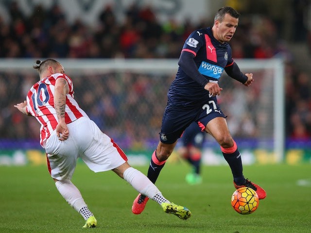 Steven Taylor and Marko Arnautovic in action during the Premier League game between Stoke City and Newcastle United on March 2, 2016