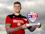 Aden Flint poses with his player of the month award for February 2016