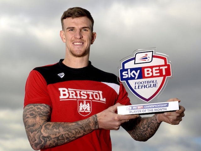 Aden Flint poses with his player of the month award for February 2016