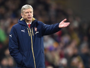 Wenger calls for "calm" ahead of Barca tie