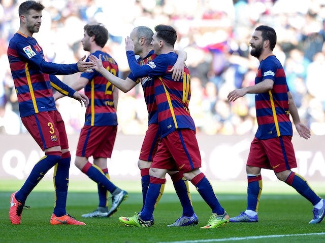 Barcelona players celebrate Getafe's own goal during the La Liga game between Barcelona and Getafe on March 12, 2016