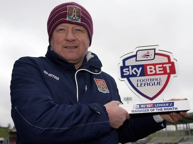 Chris Wilder poses with his manager of the month award for February 2016