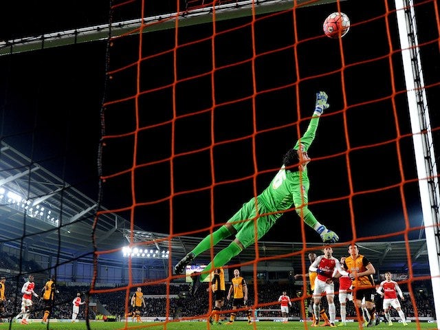 Eldin Jakupovic dives to save a shot from Kieran Gibbs which goes off the crossbar anyway! (During the FA Cup game between Hull City and Arsenal on March 8, 2016)