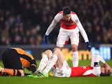 Gabriel tends to Per Mertesacker during the FA Cup game between Hull City and Arsenal on March 6, 2016