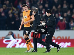 Harry Maguire receives treatment during the FA Cup game between Hull City and Arsenal on March 8, 2016