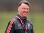 Louis van Gaal smiles during a Manchester United training session on March 9, 2016
