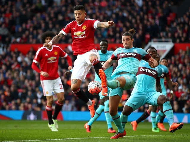 Marcos Rojo vies with Andy Carroll during the FA Cup game between Manchester United and West Ham United on March 13, 2016
