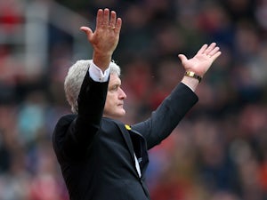 Hughes denies swearing at fourth official